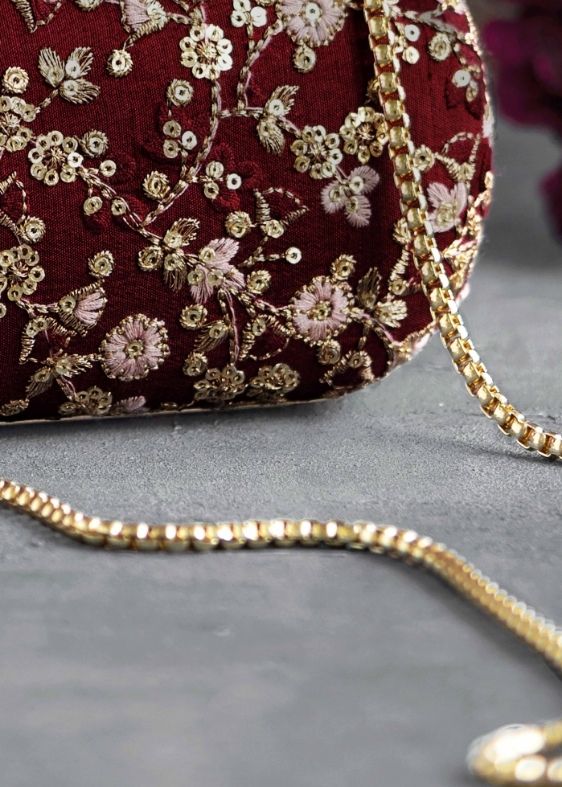 Elan maroon silk capsule clutch