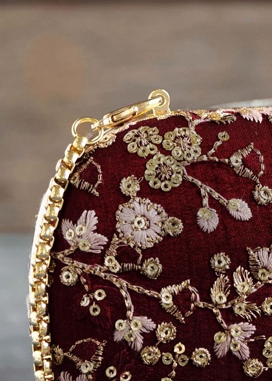 Elan maroon silk capsule clutch