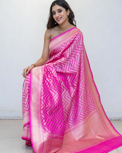 Woman wearing a pink and white saree with a white background