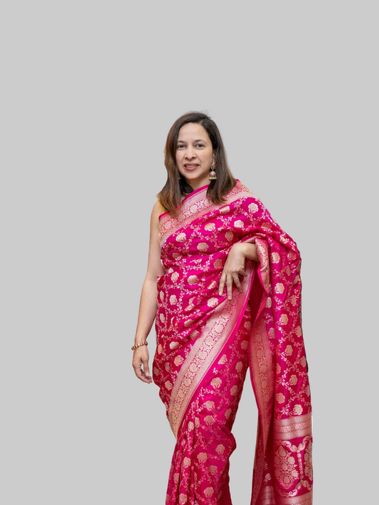Woman in a pink banarasi saree 