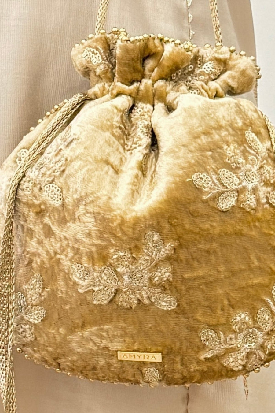 Ras Velvet Embroidered Potli - Gold
AM-PT-0526-0007