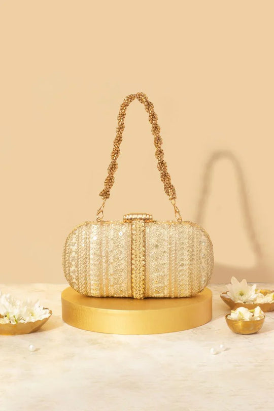 Naaz Embroidered Capsule Clutch - Gold
AM-BC-0924-0003